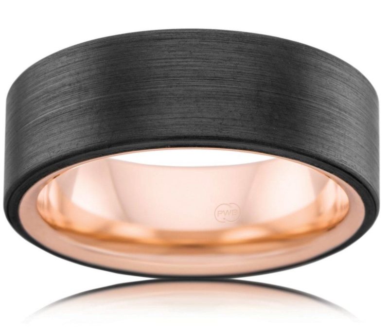 Modern and slick zirconium sleeve over 9ct rose gold. Worn as a dress ring or a wedding band.