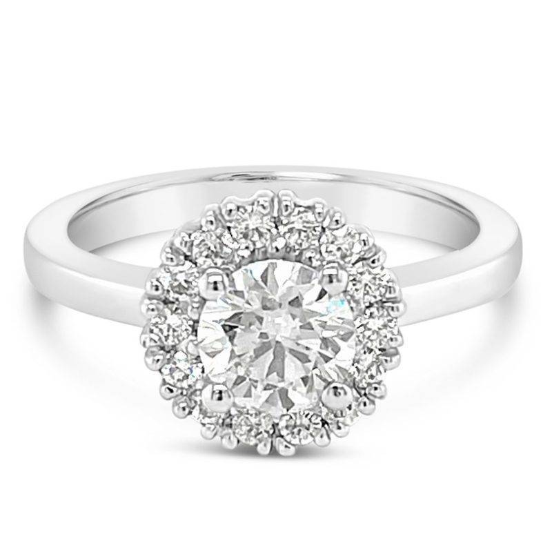 Gorgeous diamond halo engagement ring featuring a stunning .70ct G/Si diamond! A modern design with a beautiful diamond.