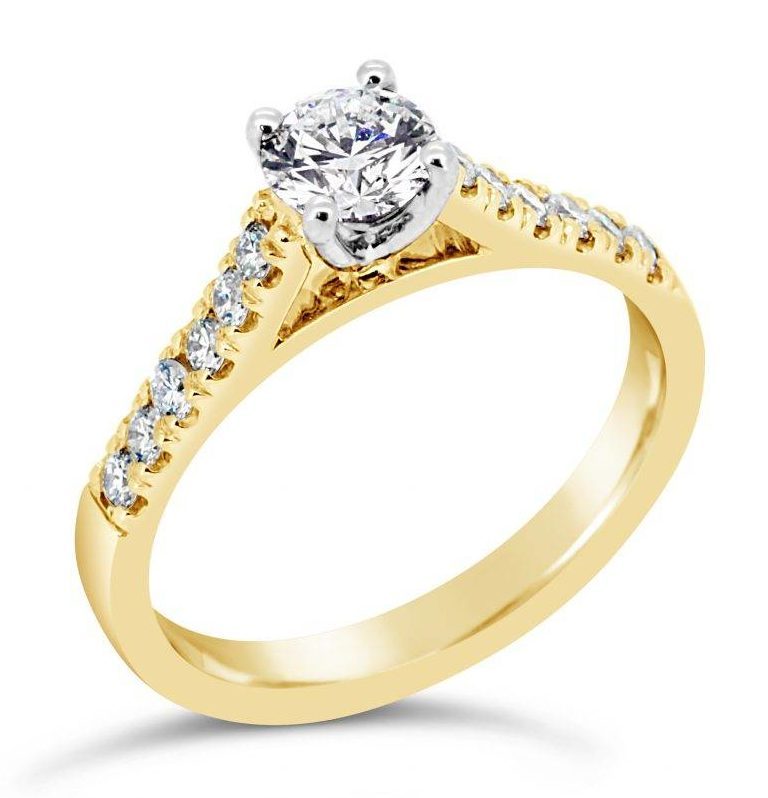 Promise perfection with this traditional yellow gold engagement ring, featuring a stunning half carat F/Si diamond.