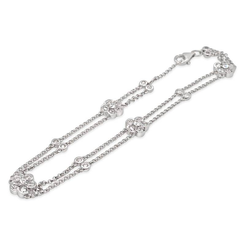 Crafted from 18ct White Gold this exquisite bracelet features a total diamond weight of .78ct in round brilliant diamonds set in a cluster to form a flower shape.