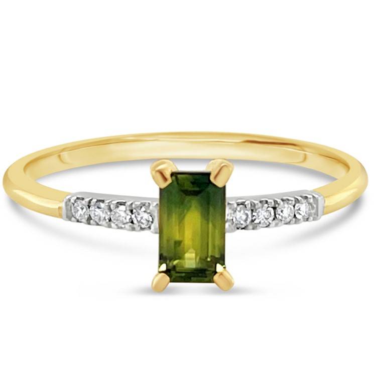 This emerald cut Parti Sapphire and Diamond ring in yellow gold is beautiful with its petite design. Visit our showroom to try on today.